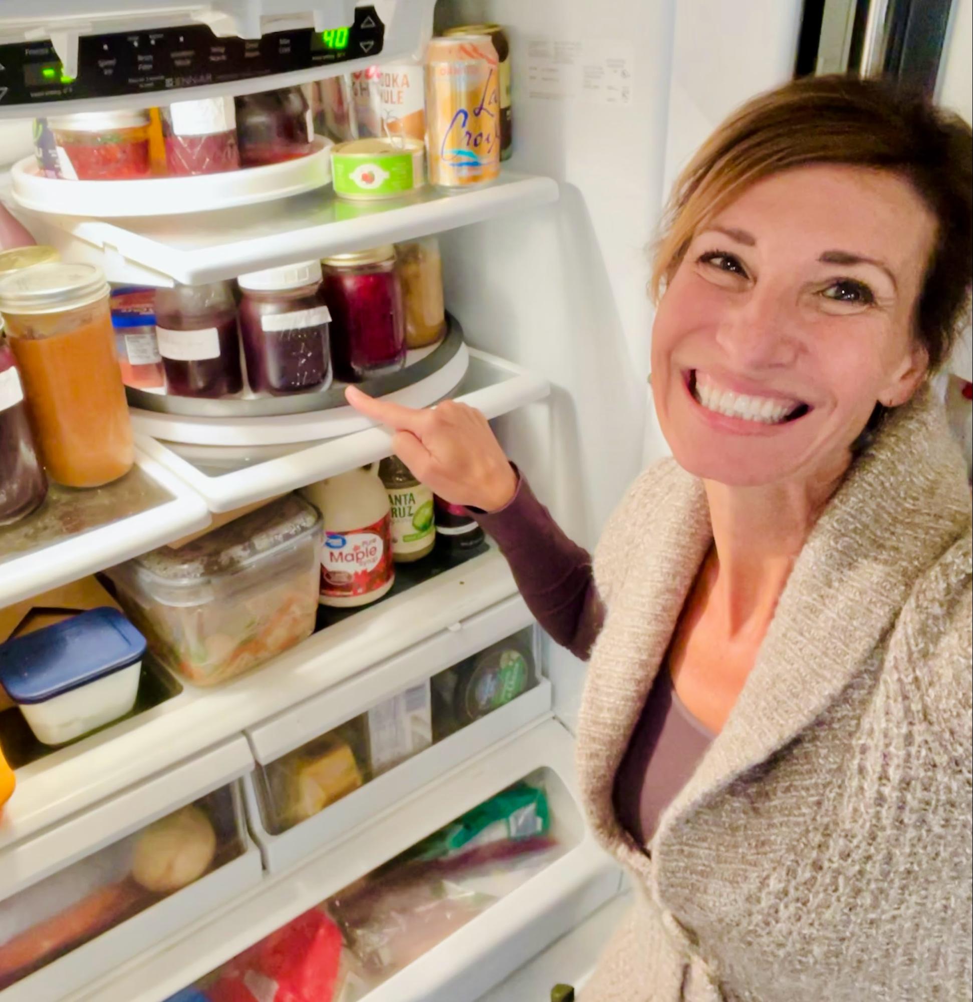 Nicole Apelian showing off the bone broth inher fridge