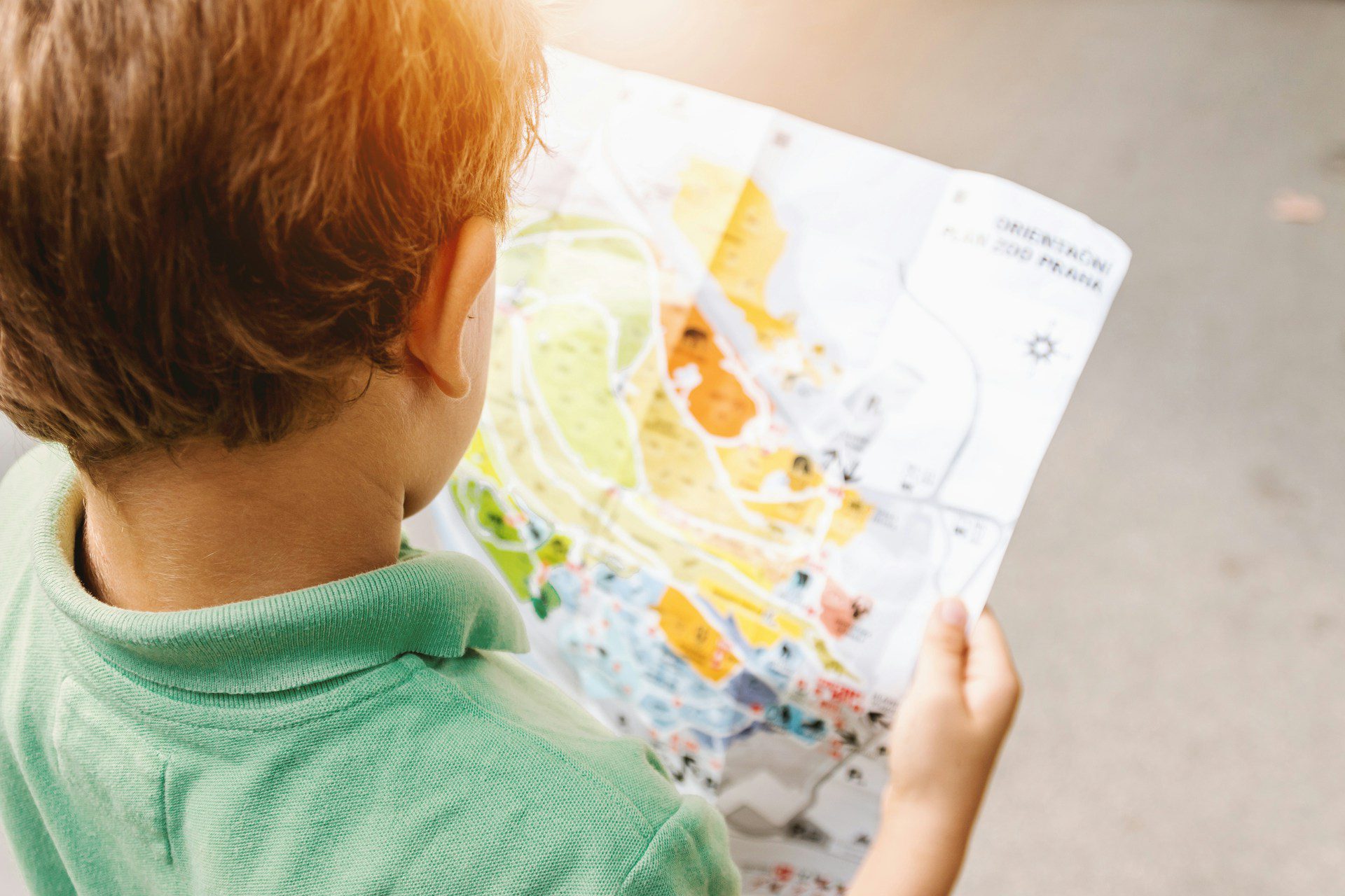 child reading map