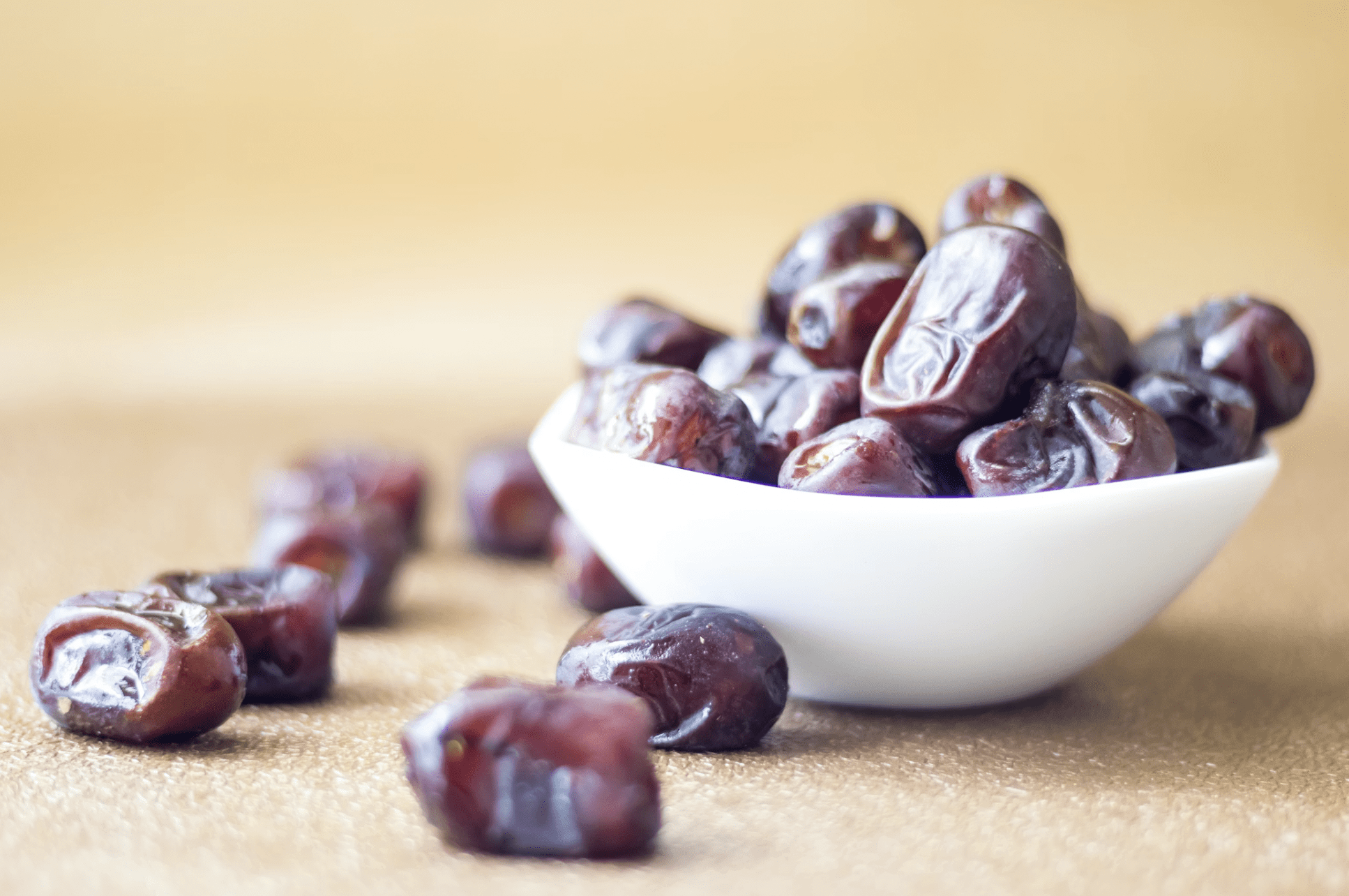 bowl dates white bowl of dried dates on tabletop